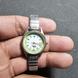 Nurse Mates Ladies Quartz Watch Silvertone Green And White Dial Working shows si